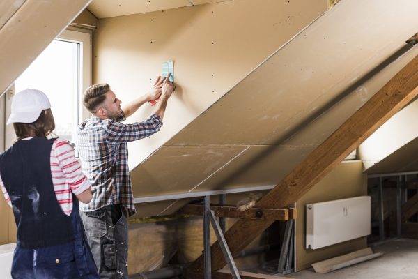 Young couple renovating their new home